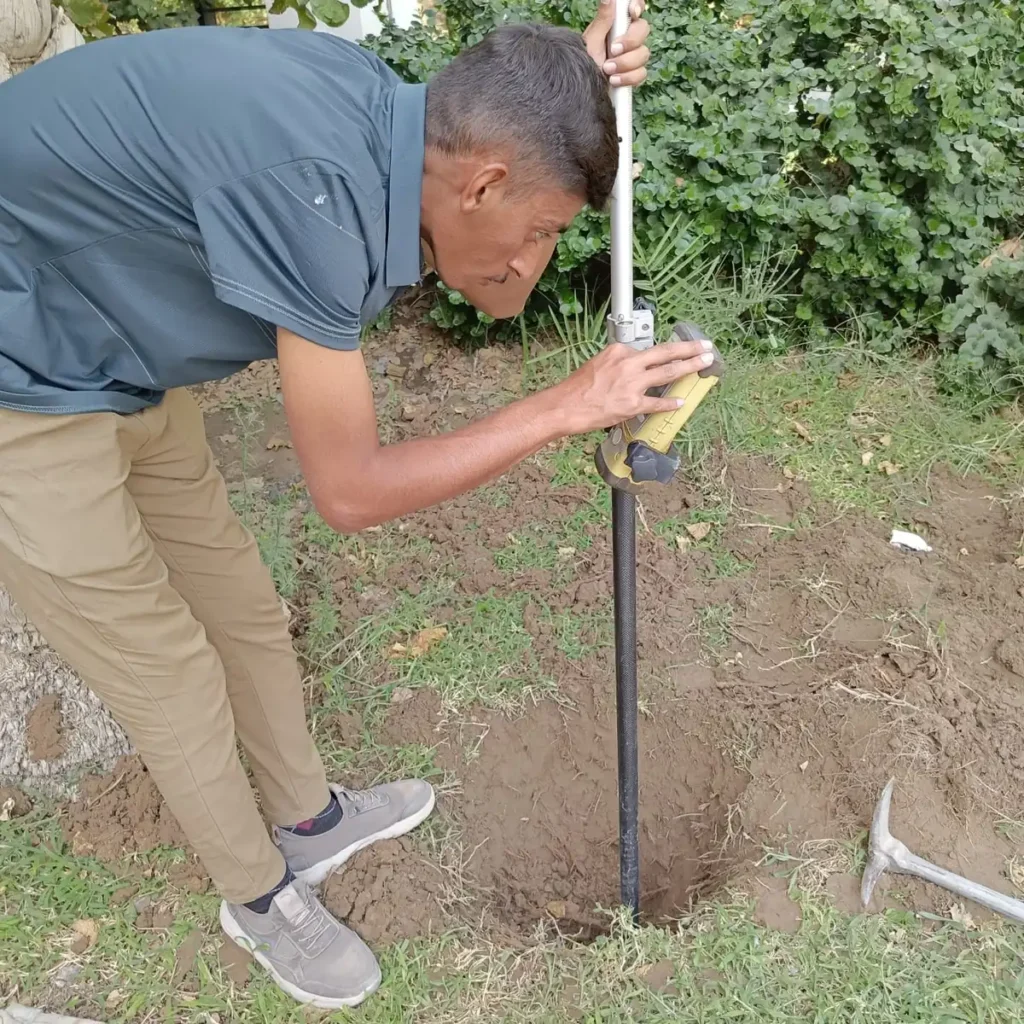 Setting a transmitter earth stake to apply a signal to a buried service