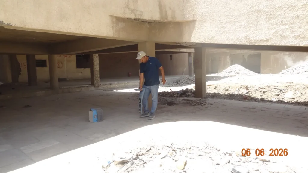 Locating buried services beneath an existing concrete structure on the site