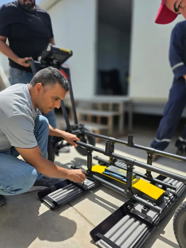Trainees examining the GPR control unit at the practical session