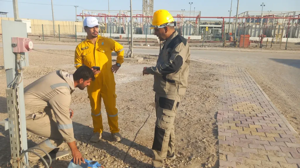 Field session applying a signal to a buried service at the oil field facility