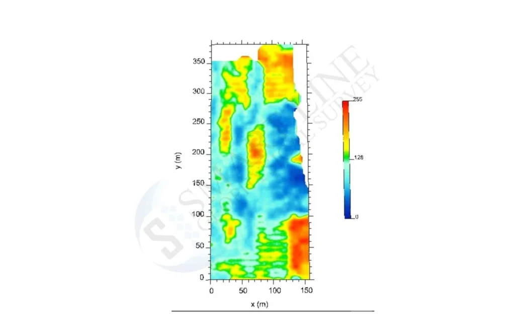 GPR amplitude depth slice across a survey area of roughly 150 by 380 metres, with warm colours marking void anomalies within the limestone layer