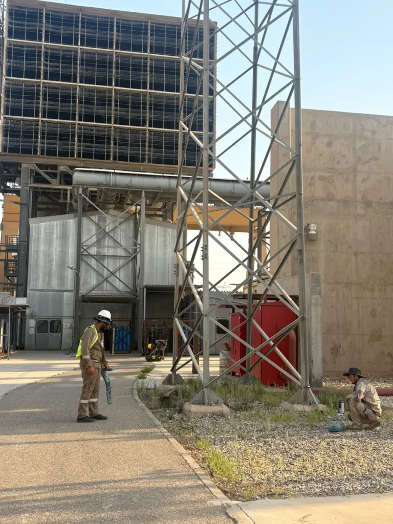 Tracing a buried service with the Radiodetection RD8200 locator beside a lattice tower
